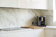 coffee maker infront of marble splashback